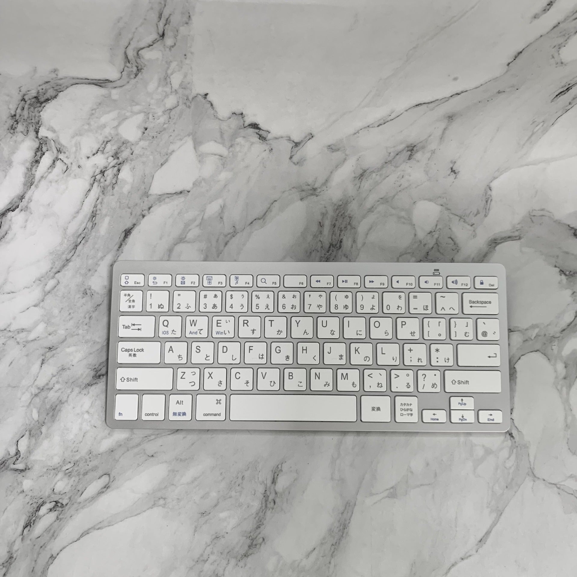 The Ultimate White Wireless Mini Bluetooth Keyboard - Unleash Your Productivity
